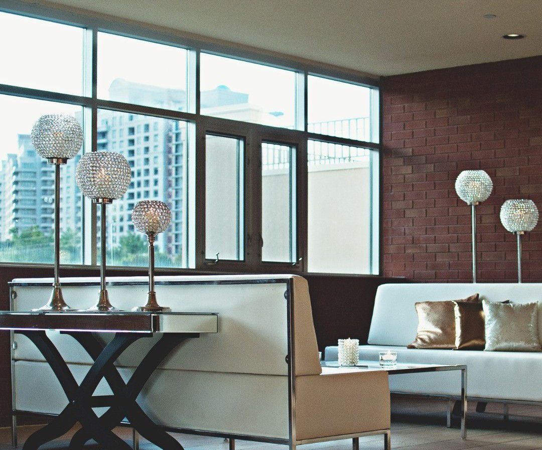 A living room with a couch a chair and a table