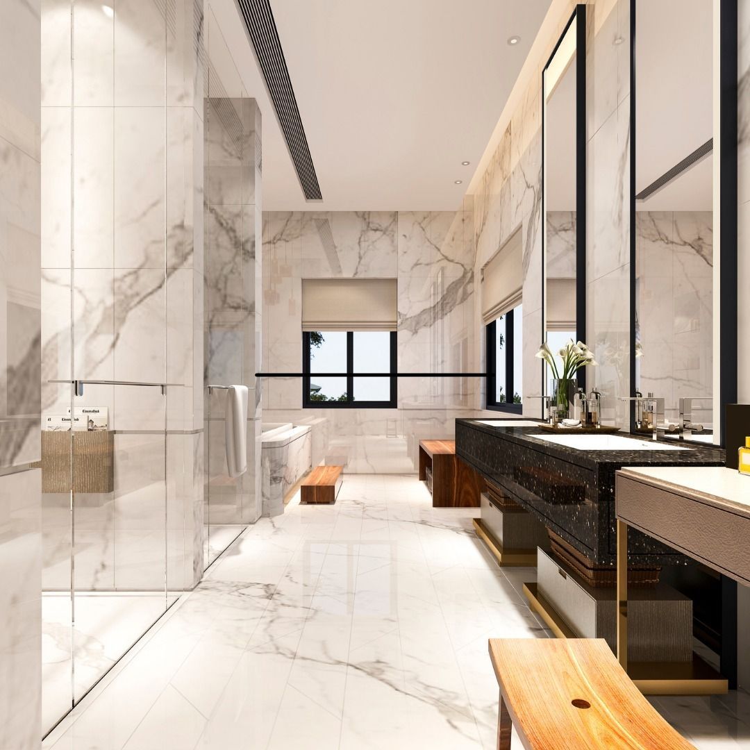 A bathroom with marble walls and a walk in shower
