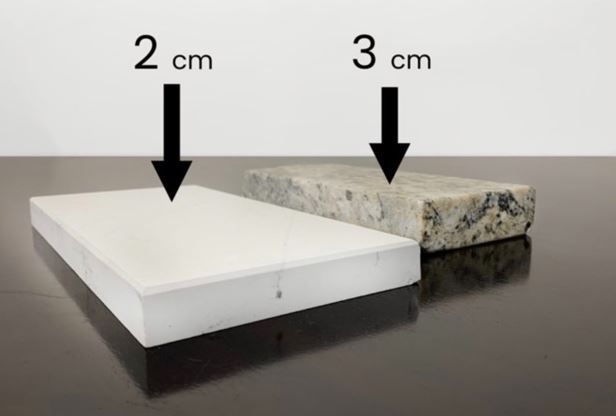 Two pieces of marble with arrows pointing down to show their sizes