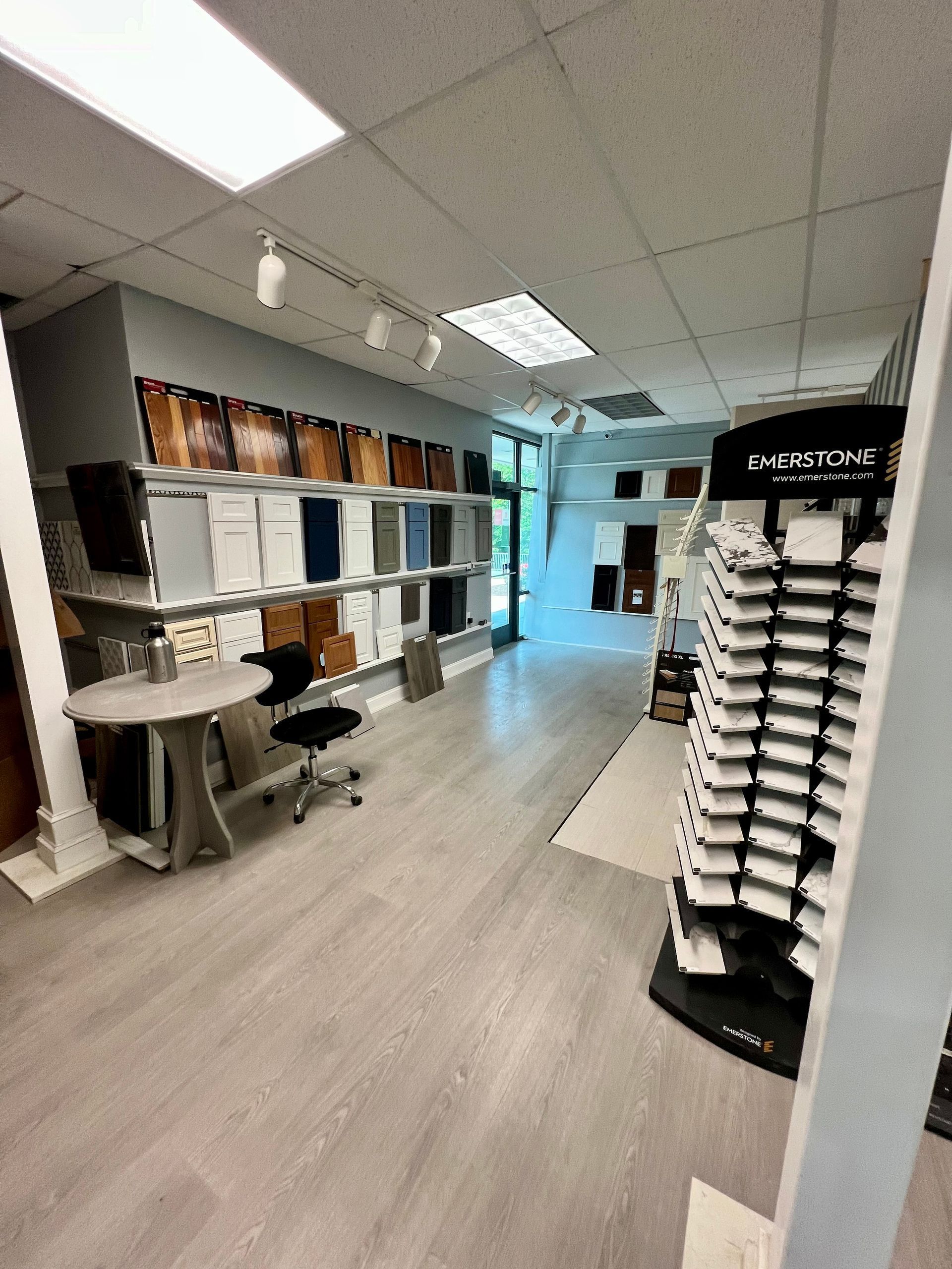 A large room with a lot of shelves and glasses on display.