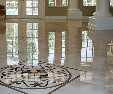 A marble floor with a circular design on it
