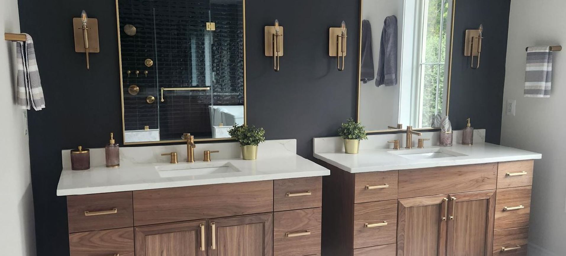 A bathroom with two sinks and two mirrors.
