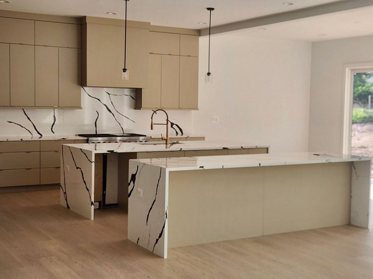 A kitchen with a large island in the middle