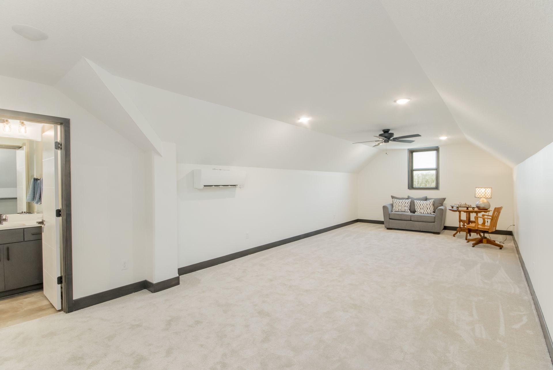 There is a couch and a table in the room.