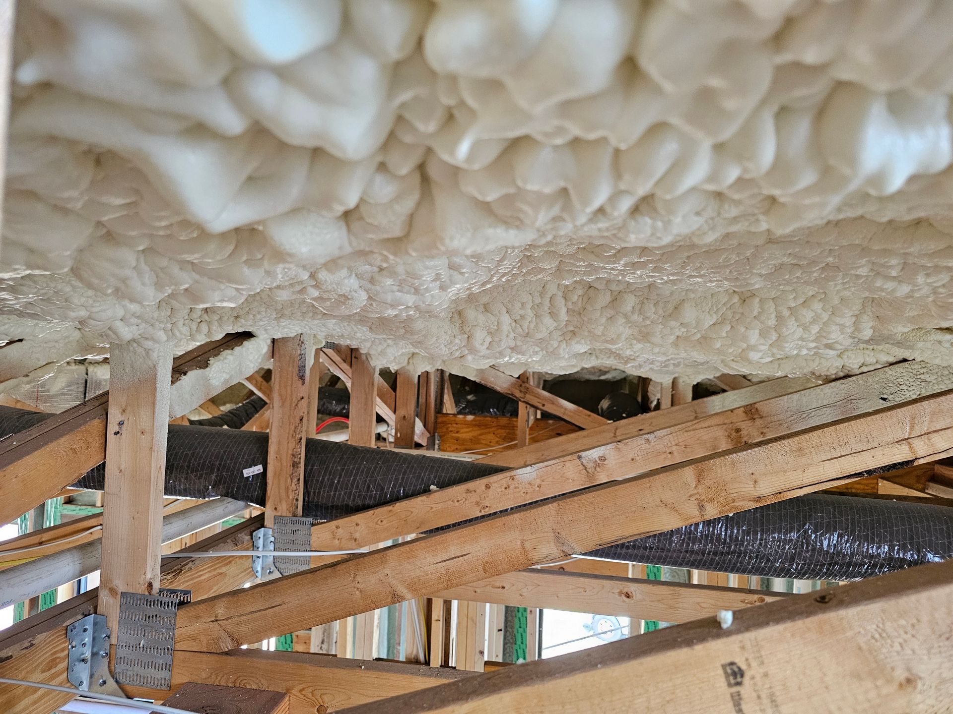 A foam on the ceiling of a building under construction.