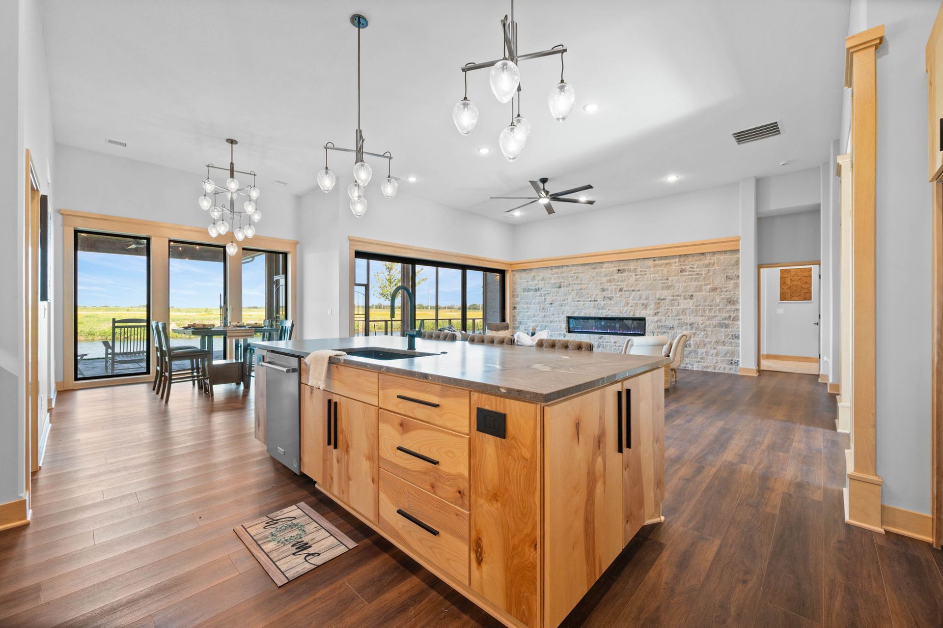 A kitchen with a large island in the middle of the room.