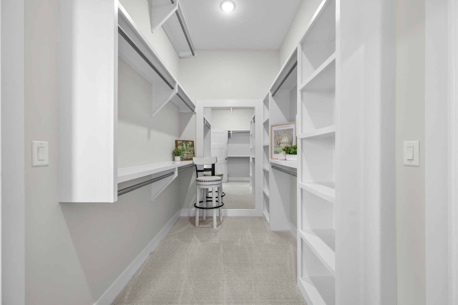 A walk in closet in a house.