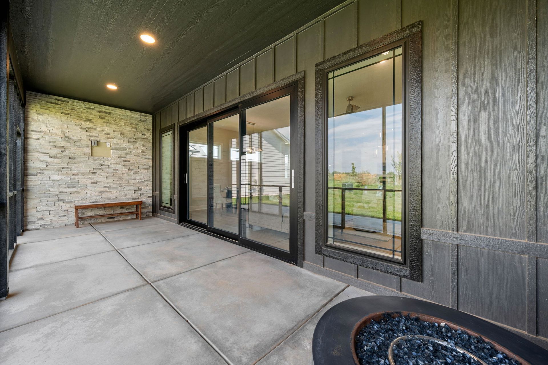 A patio with sliding glass doors.