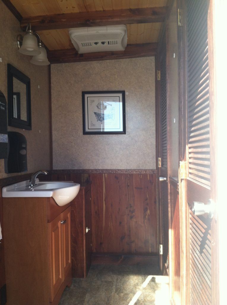 a bathroom with a sink and a picture on the wall