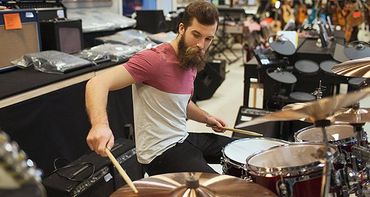 Playing drums in music store
