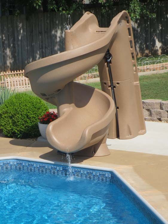 A brown slide is next to a blue pool