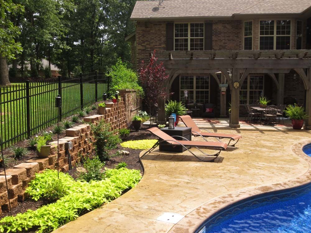 A large house with a swimming pool in front of it