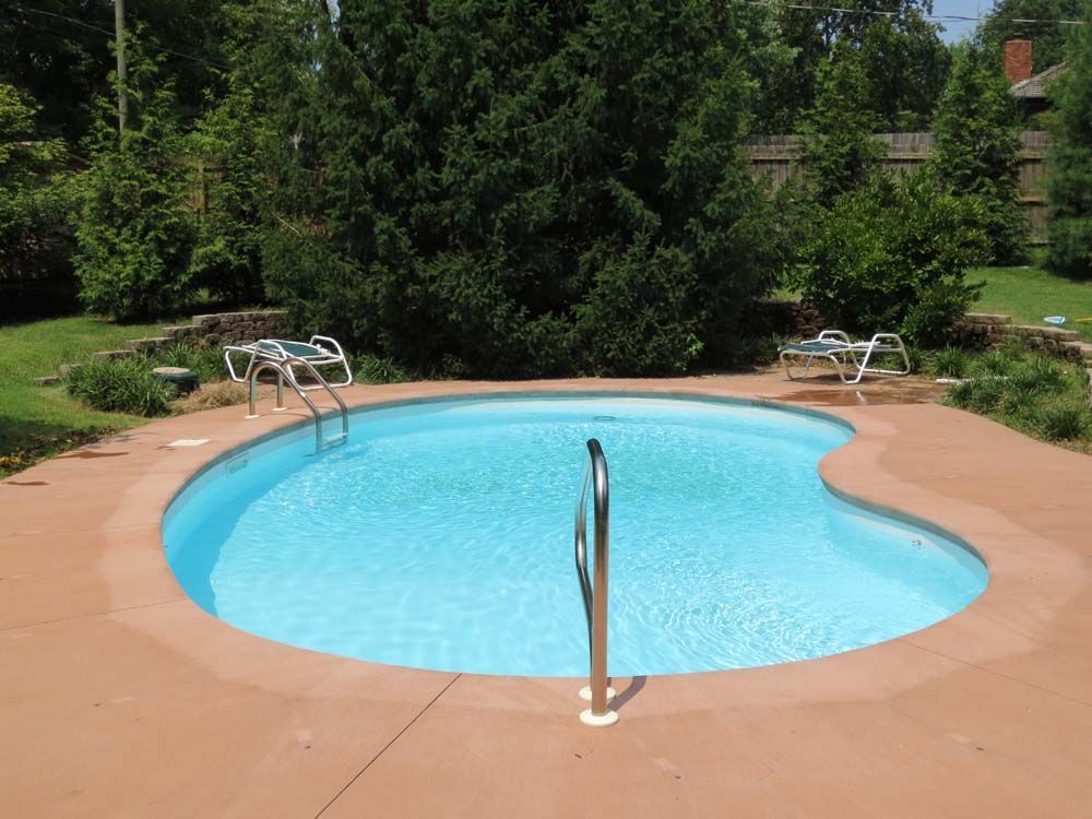 A swimming pool with a staircase leading to it