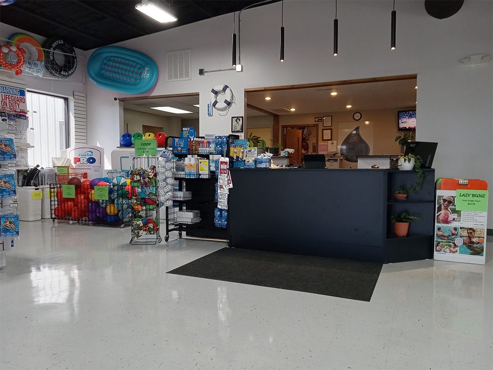 A large room with a counter in the middle of it.