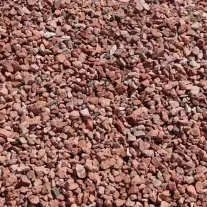 Red gravel, consisting of small, irregular rock pieces.