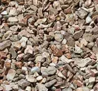 Close-up view of a pile of mixed-size gray and brown gravel.