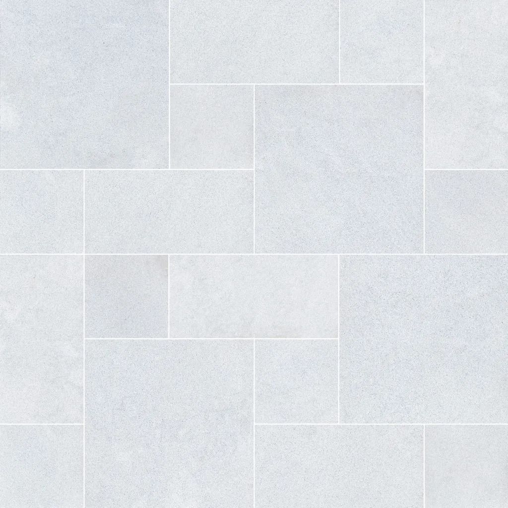 White stone tile floor with rectangular and square tiles.