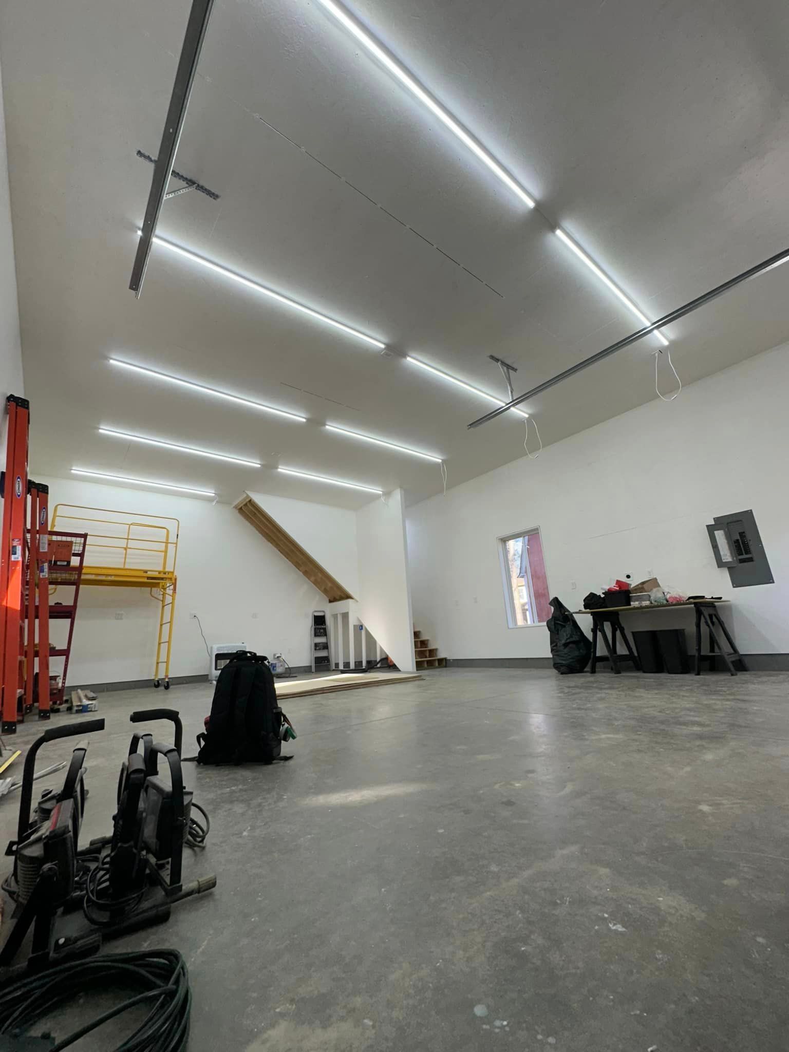 A large room with a lot of lights on the ceiling