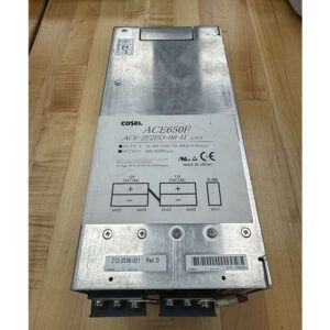 Metal power supply with labels and wiring connections on a wooden surface.