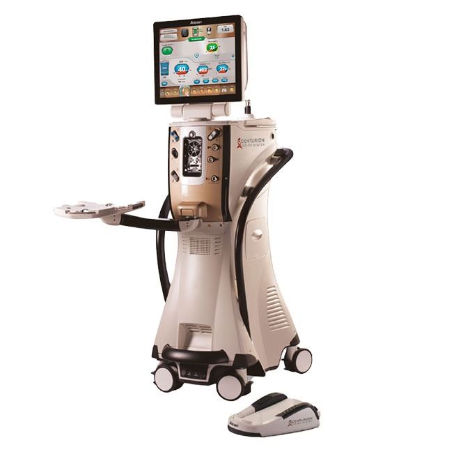Medical device with touchscreen display, console, and foot pedal. Cream and silver colors.