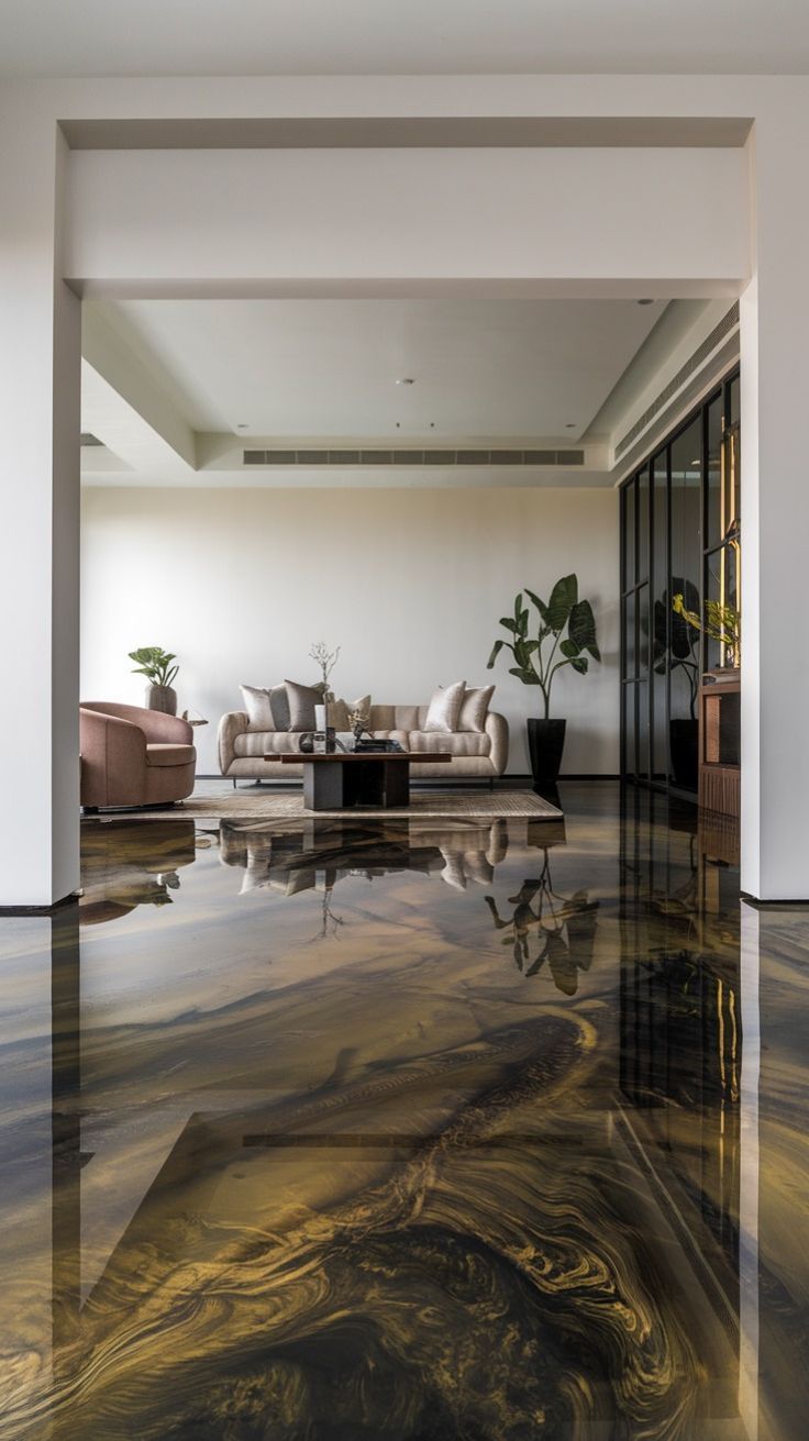 Modern living room with polished abstract floor, beige sofas, and indoor plants under soft natural light