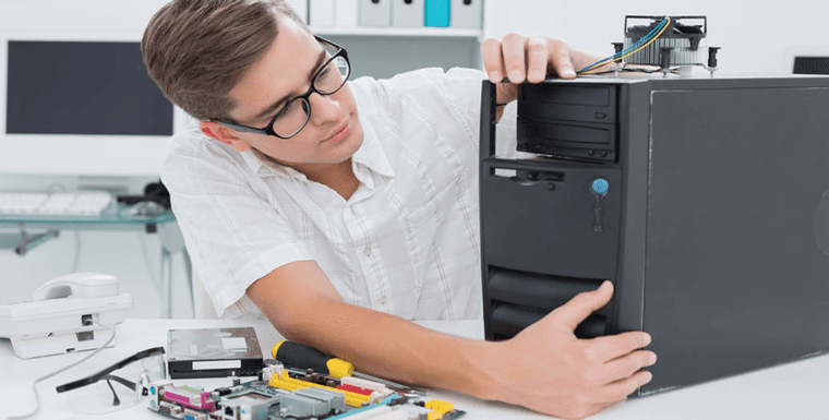 Man fixing computer tower