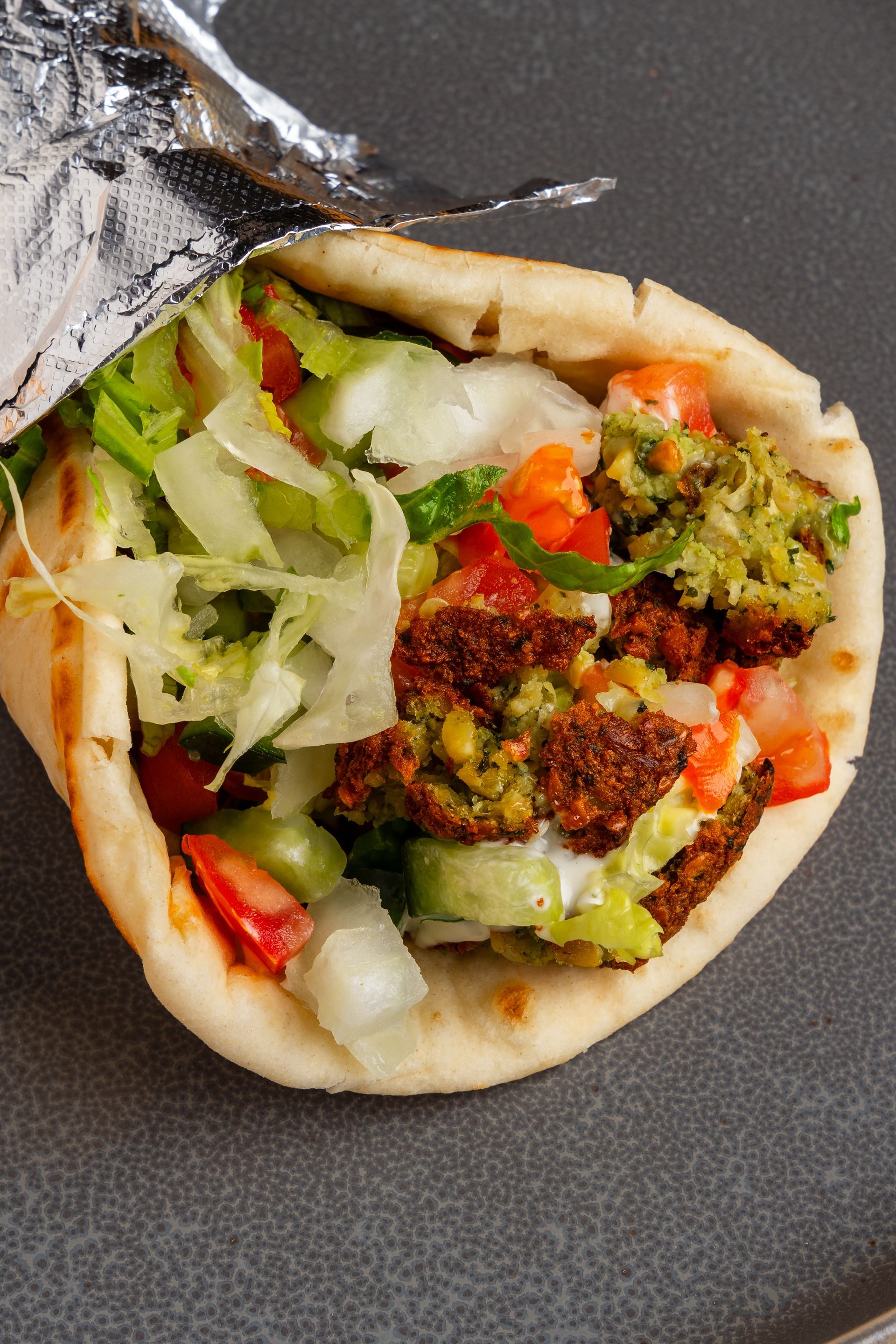 A close up of a bunch of plates of food on a table.