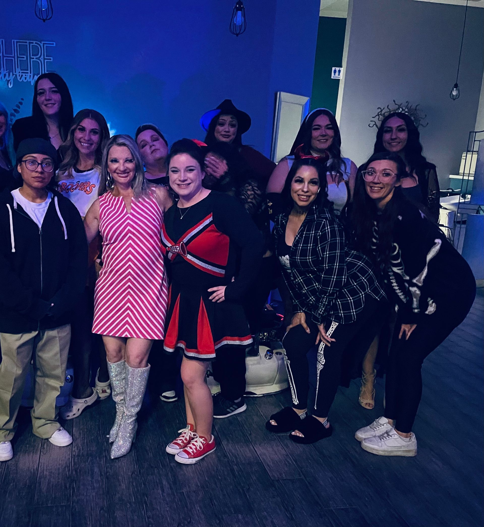 a group of people are posing for a picture together