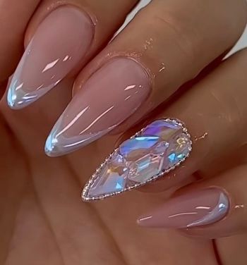 a close up of a person 's nails with a rhinestone on them .