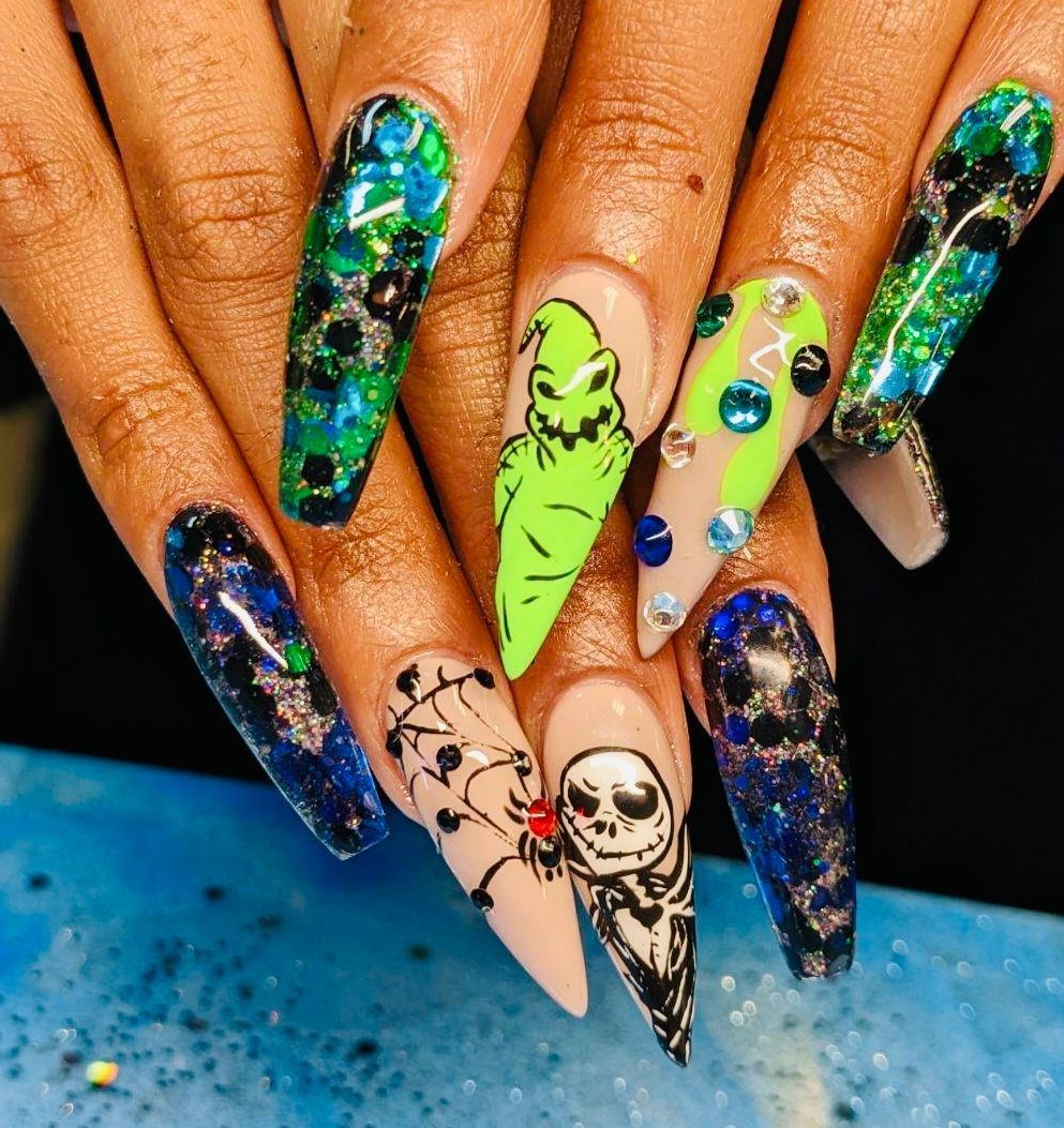 a close up of a person 's nails with a nightmare before christmas design