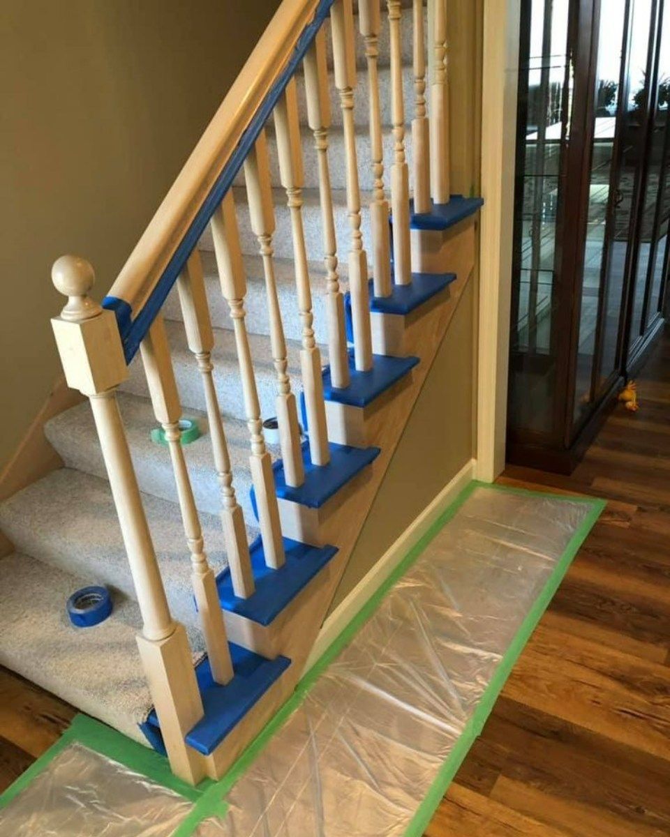 A long hallway with a green tape on the floor.