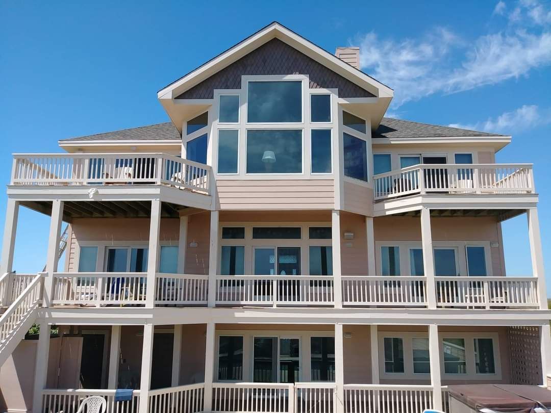 A large house with a lot of windows and balconies