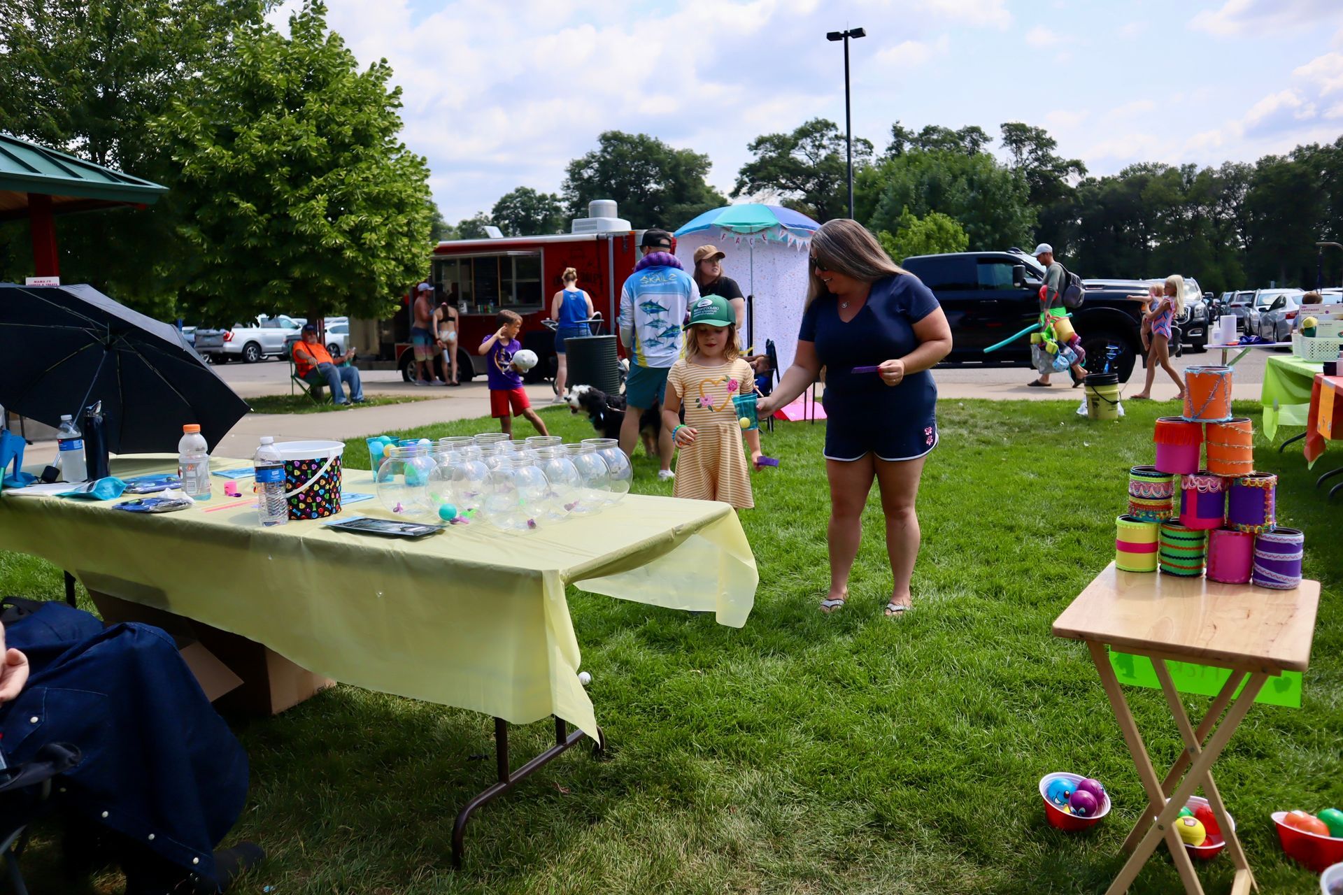 A group of people are playing a game in a park.