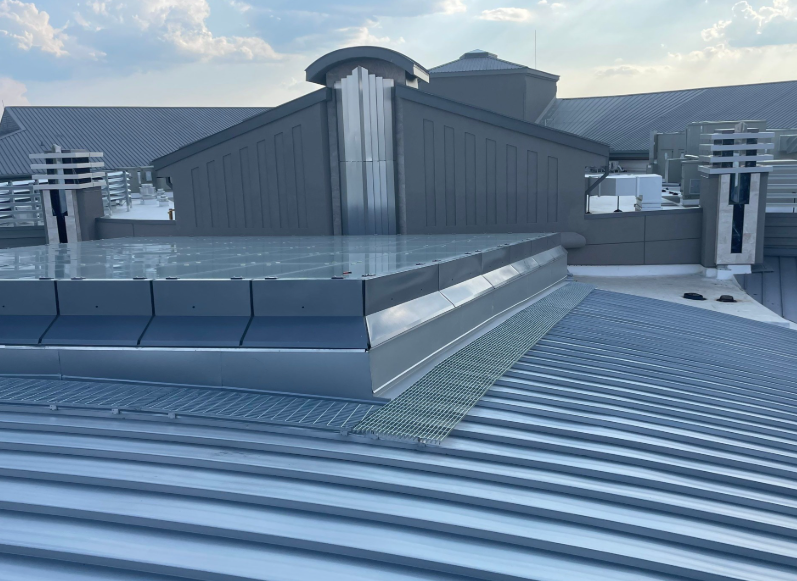 The roof of a building with a swimming pool on top of it.