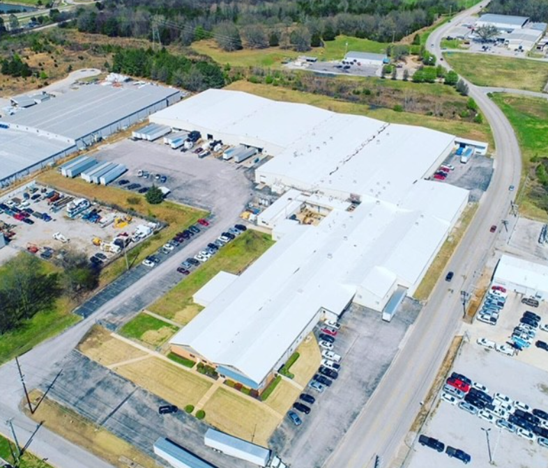 An aerial view of a large white building