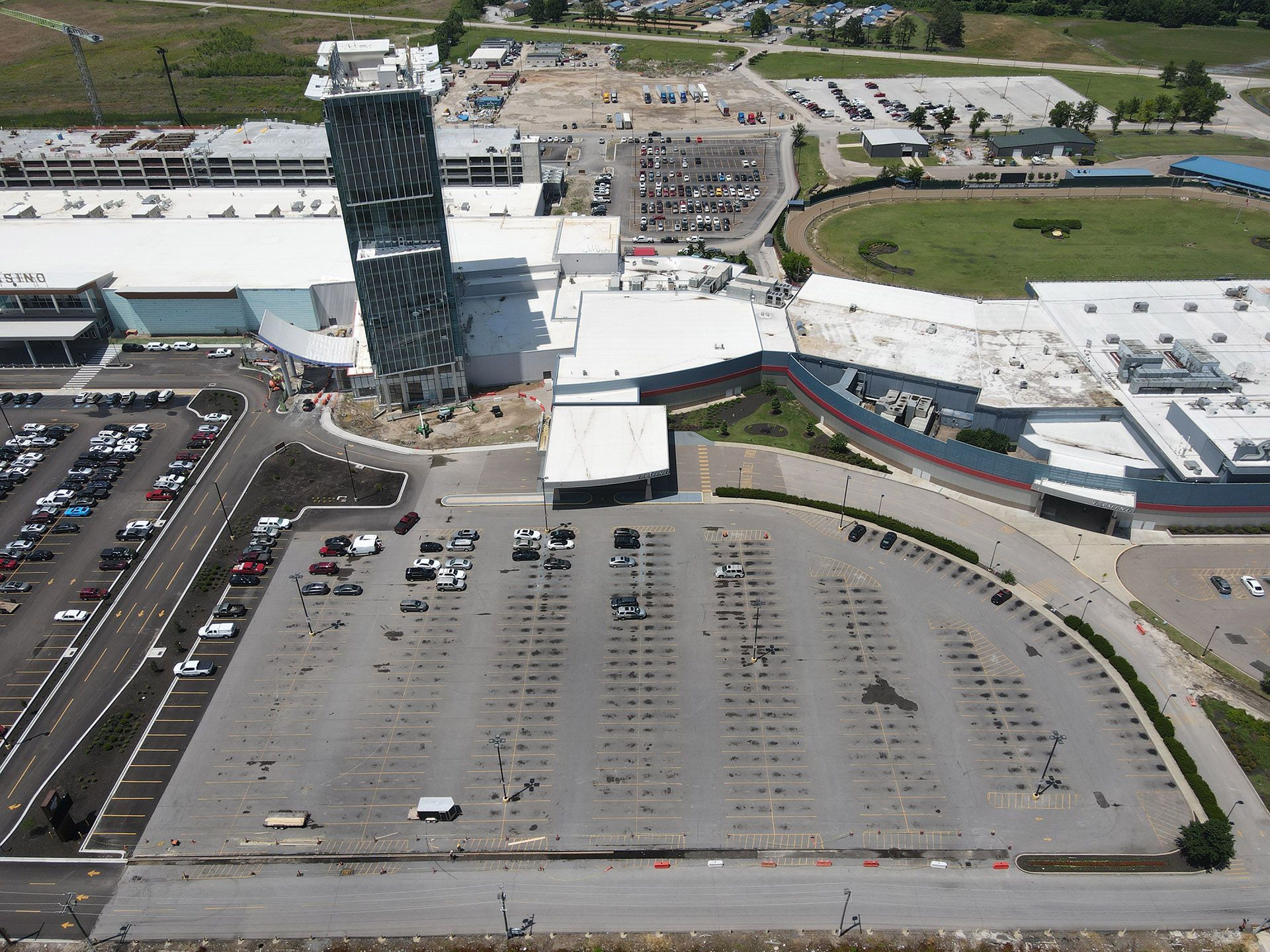 An aerial view of a parking lot in front of a large building