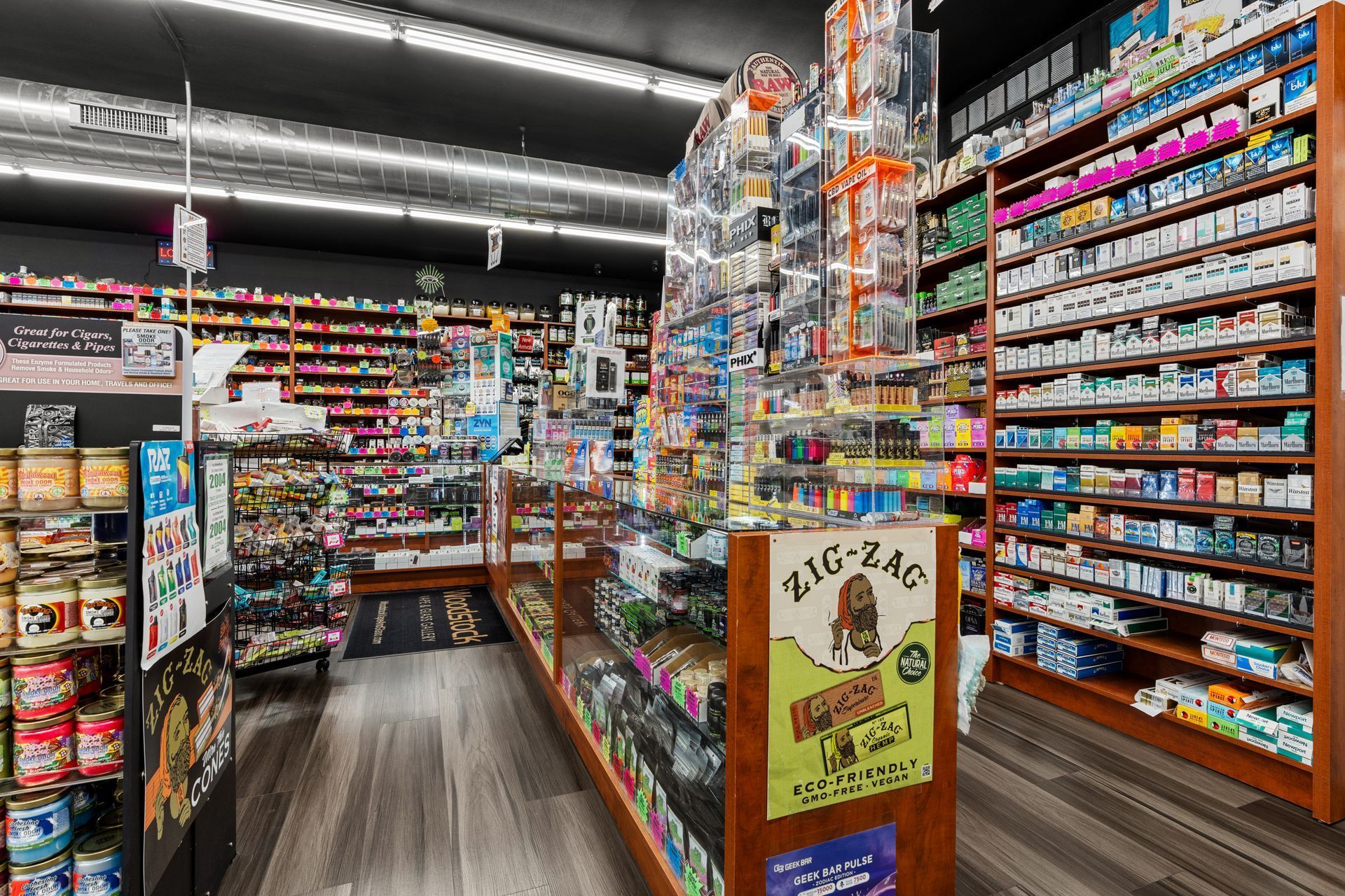 Inside a convenience store, shelves filled with various products.