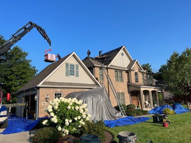 A large house with a crane on top of it.