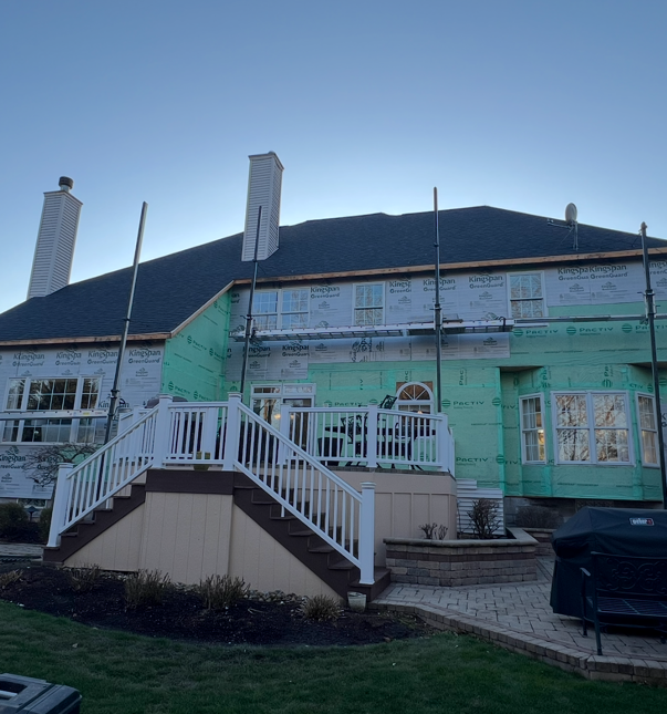 The back of a house with stairs leading up to it