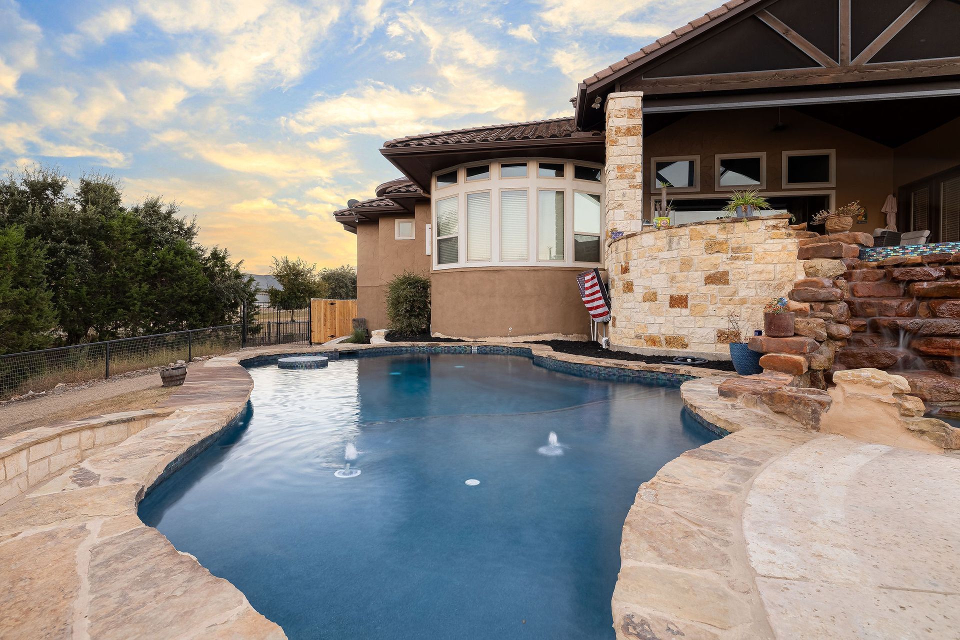 backyard pool at sunset