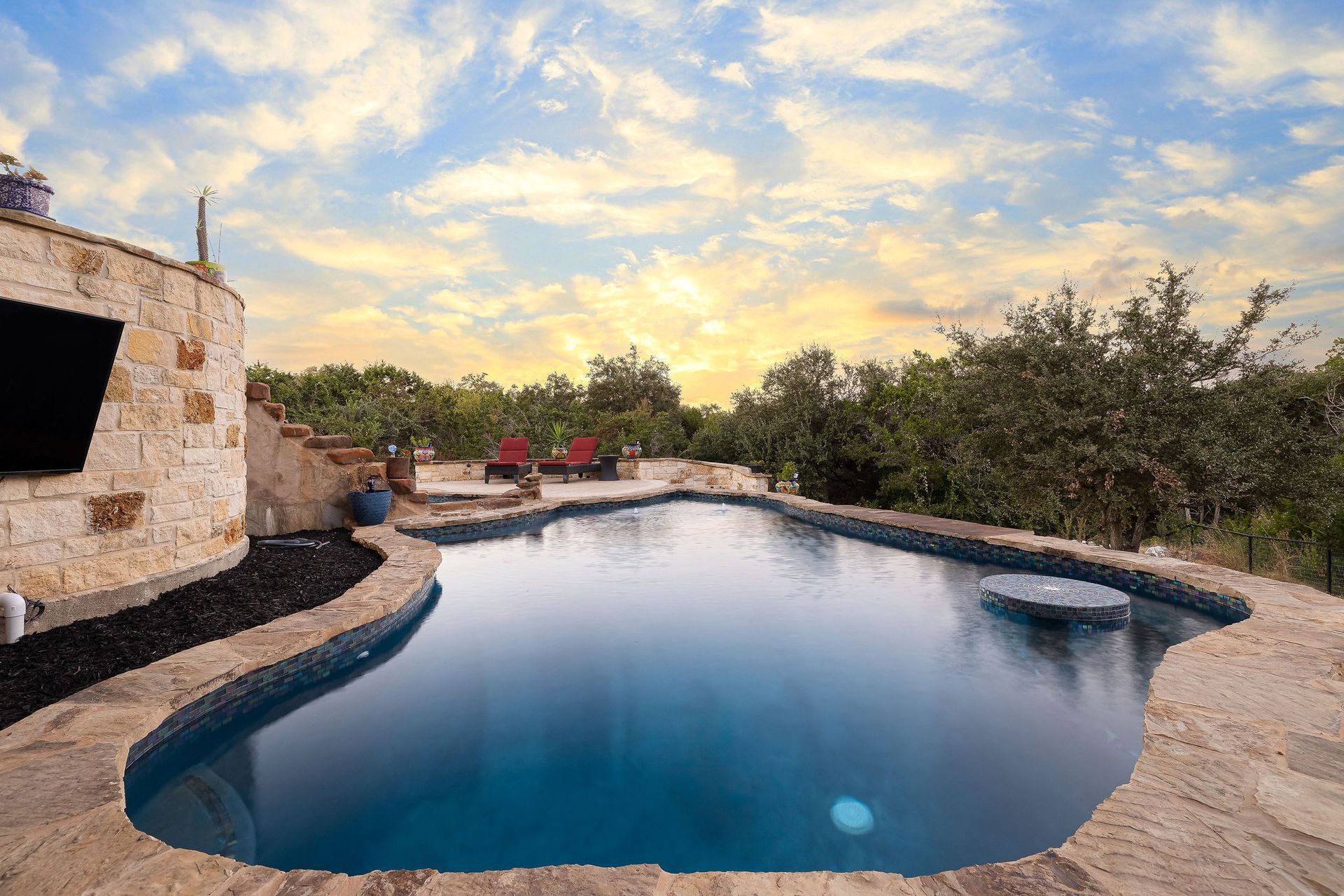 backyard pool at sunset