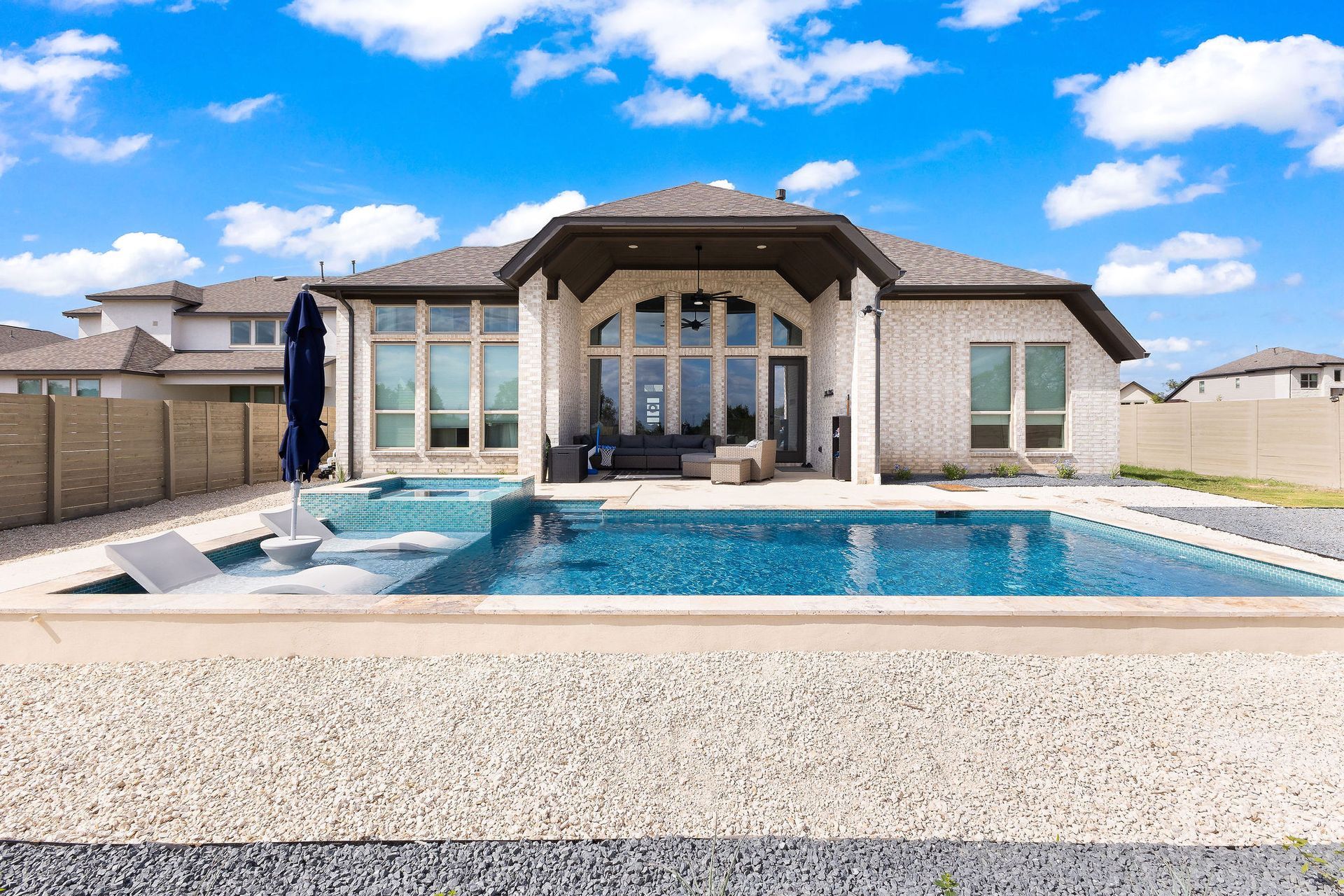 Backyard patio with a rectangular swimming pool