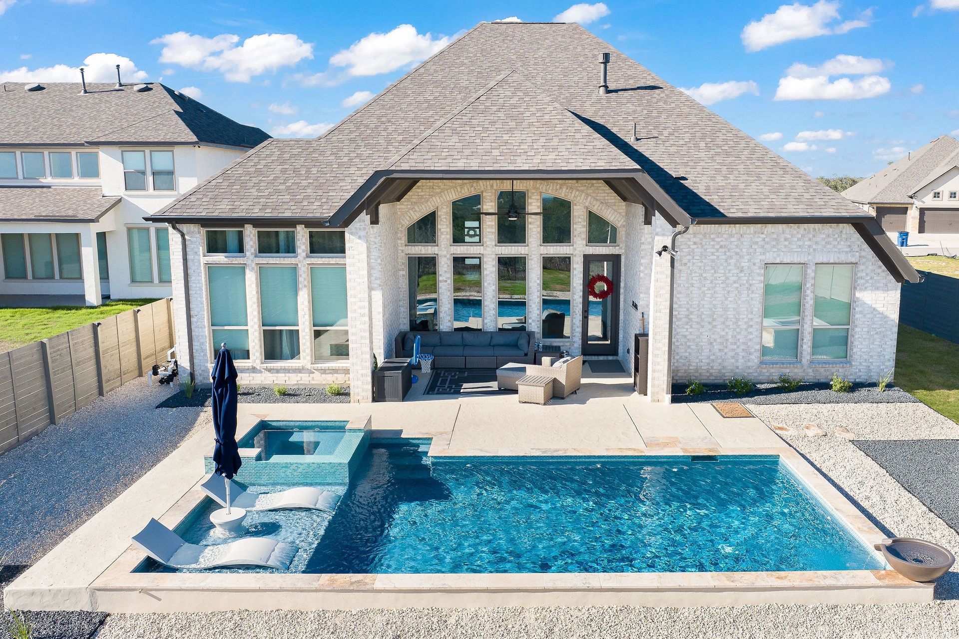 Backyard patio with a rectangular swimming pool