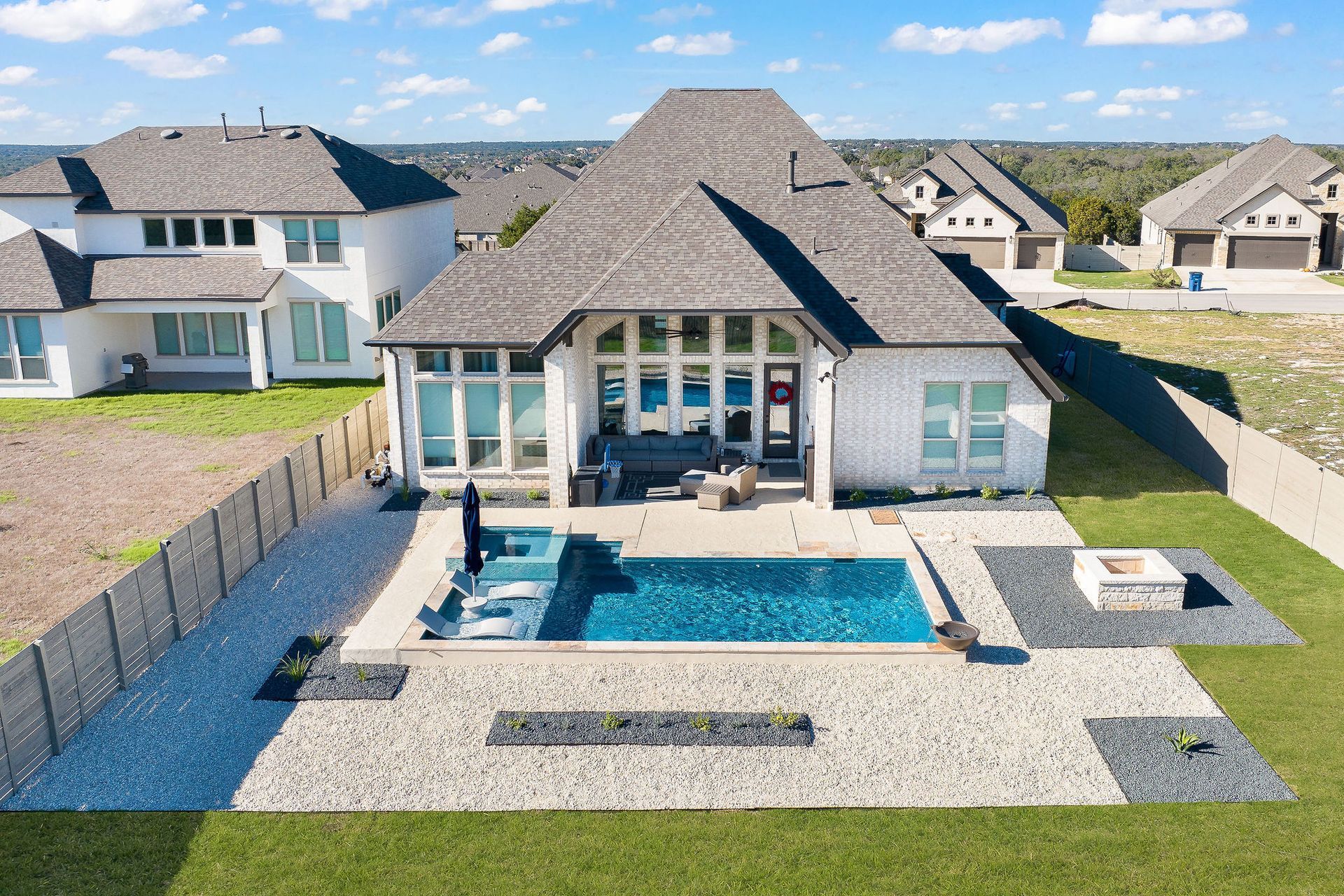 Backyard patio with a rectangular swimming pool