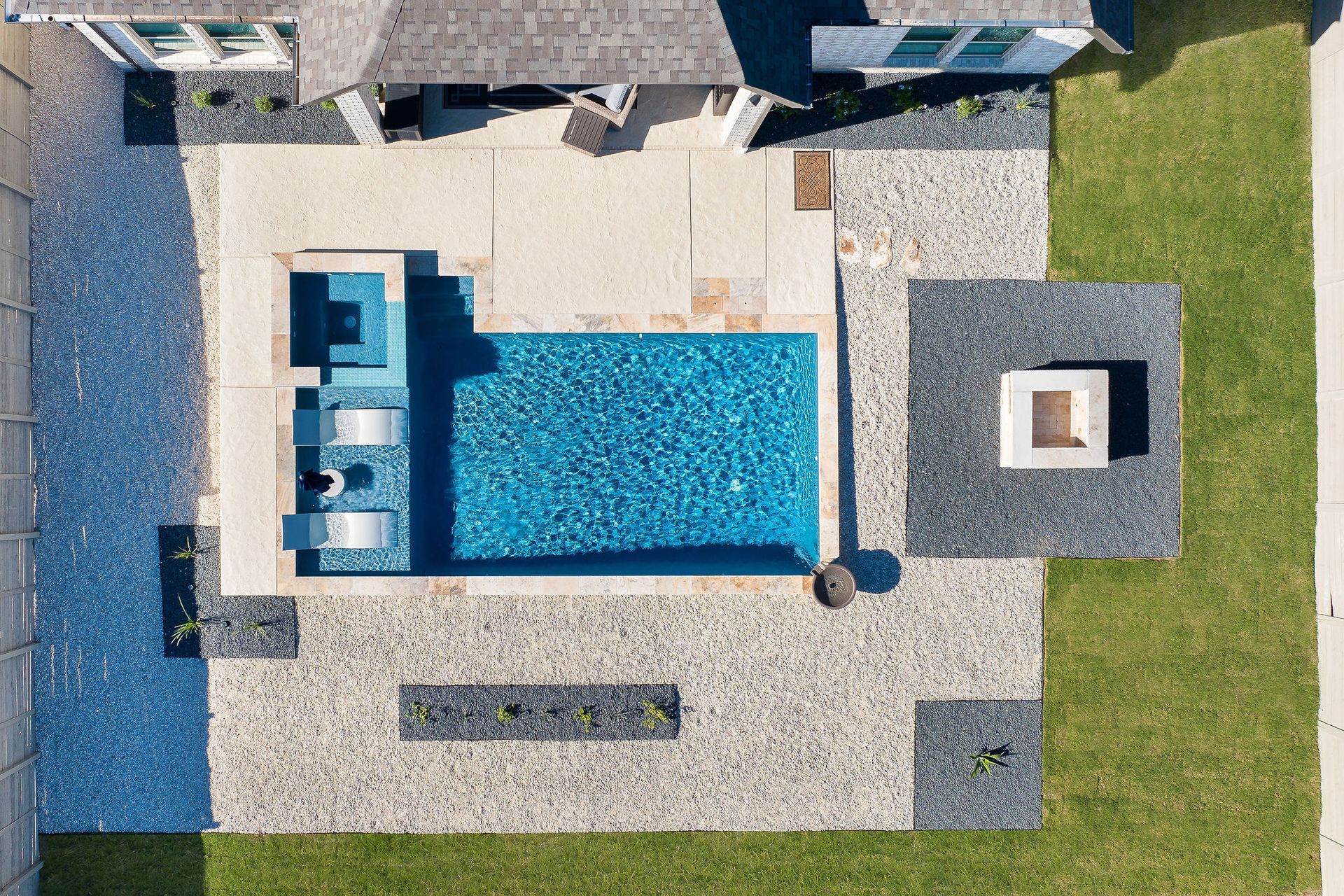Backyard patio with a rectangular swimming pool