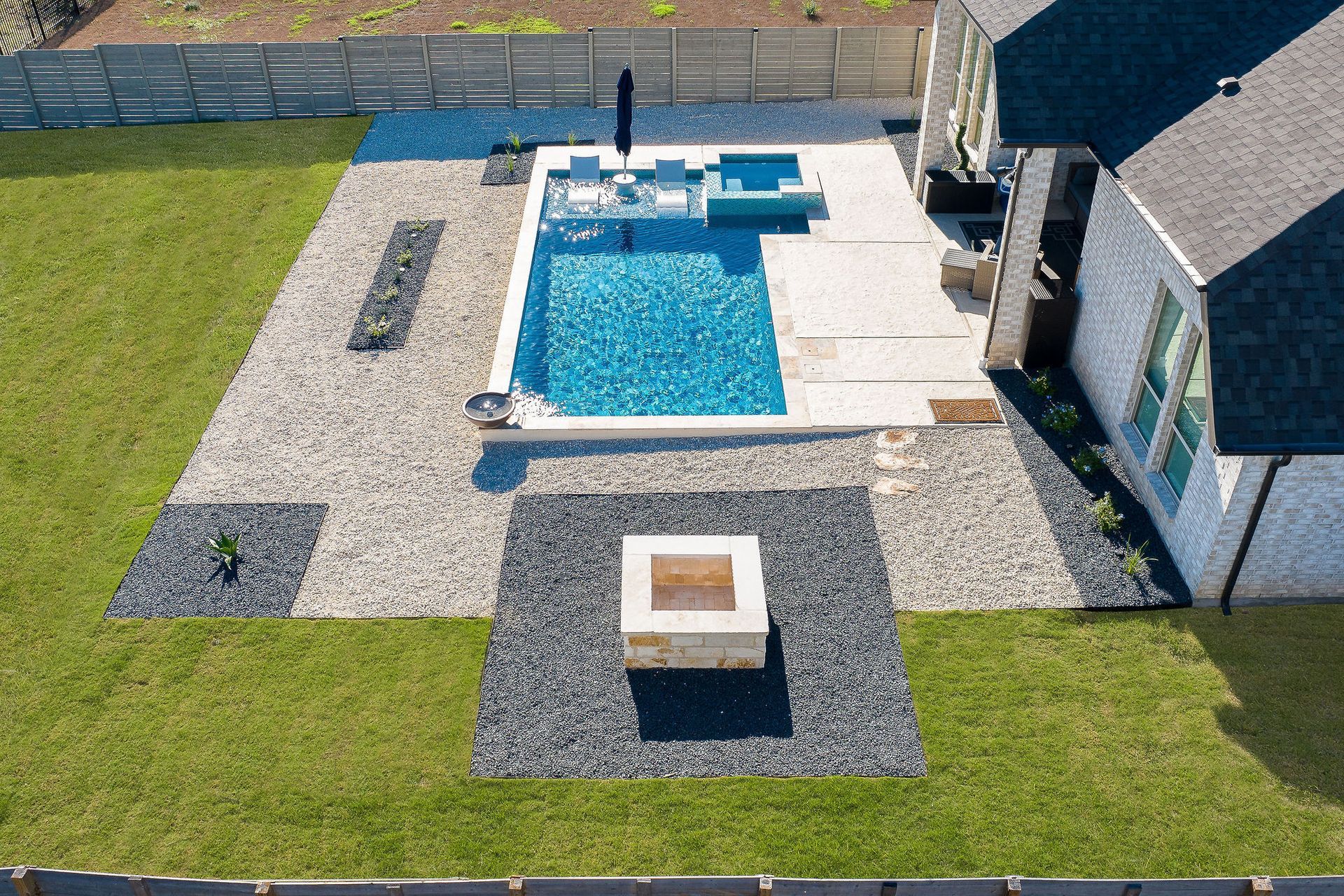 Backyard patio with a rectangular swimming pool