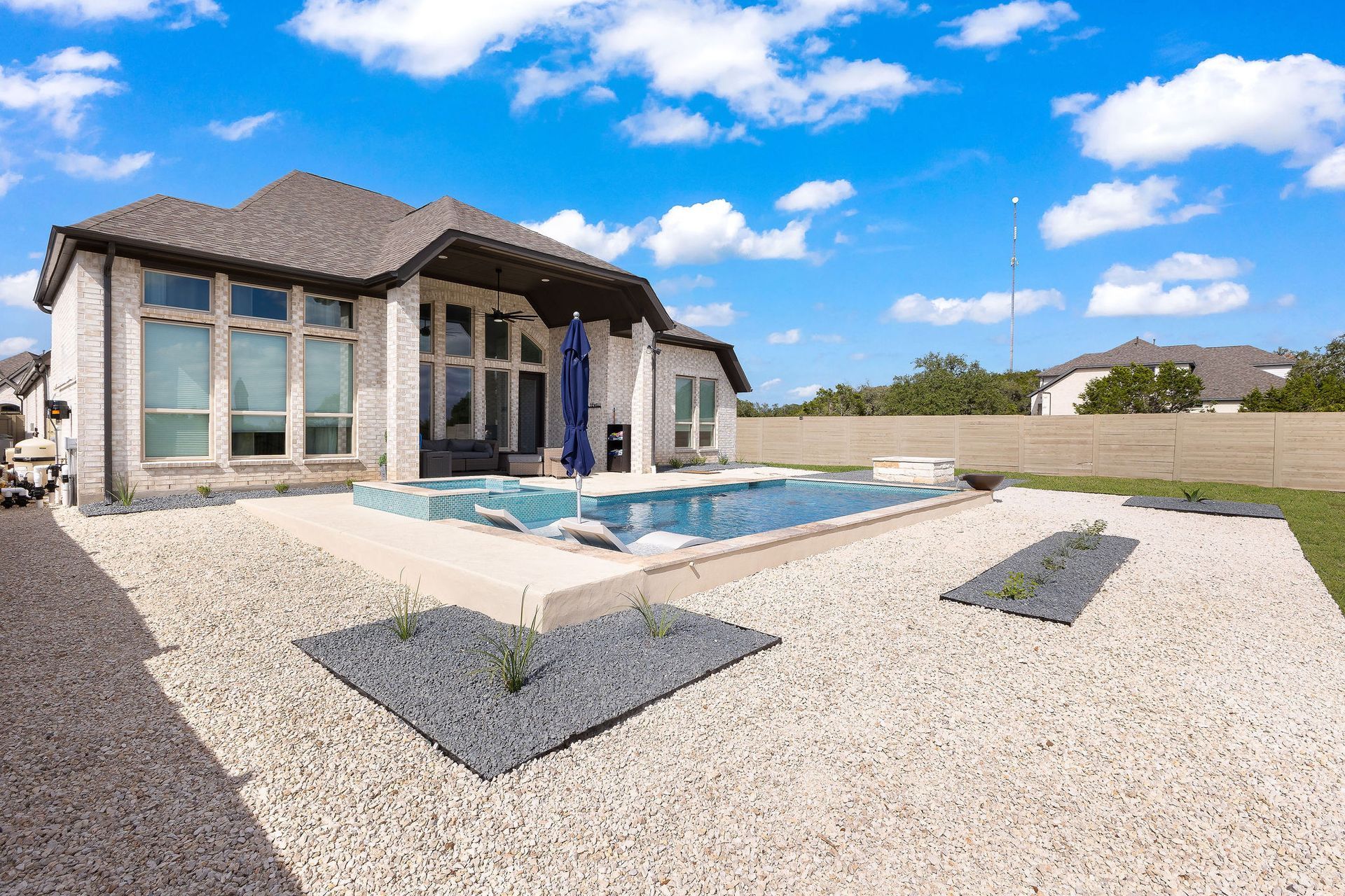 Backyard patio with a rectangular swimming pool