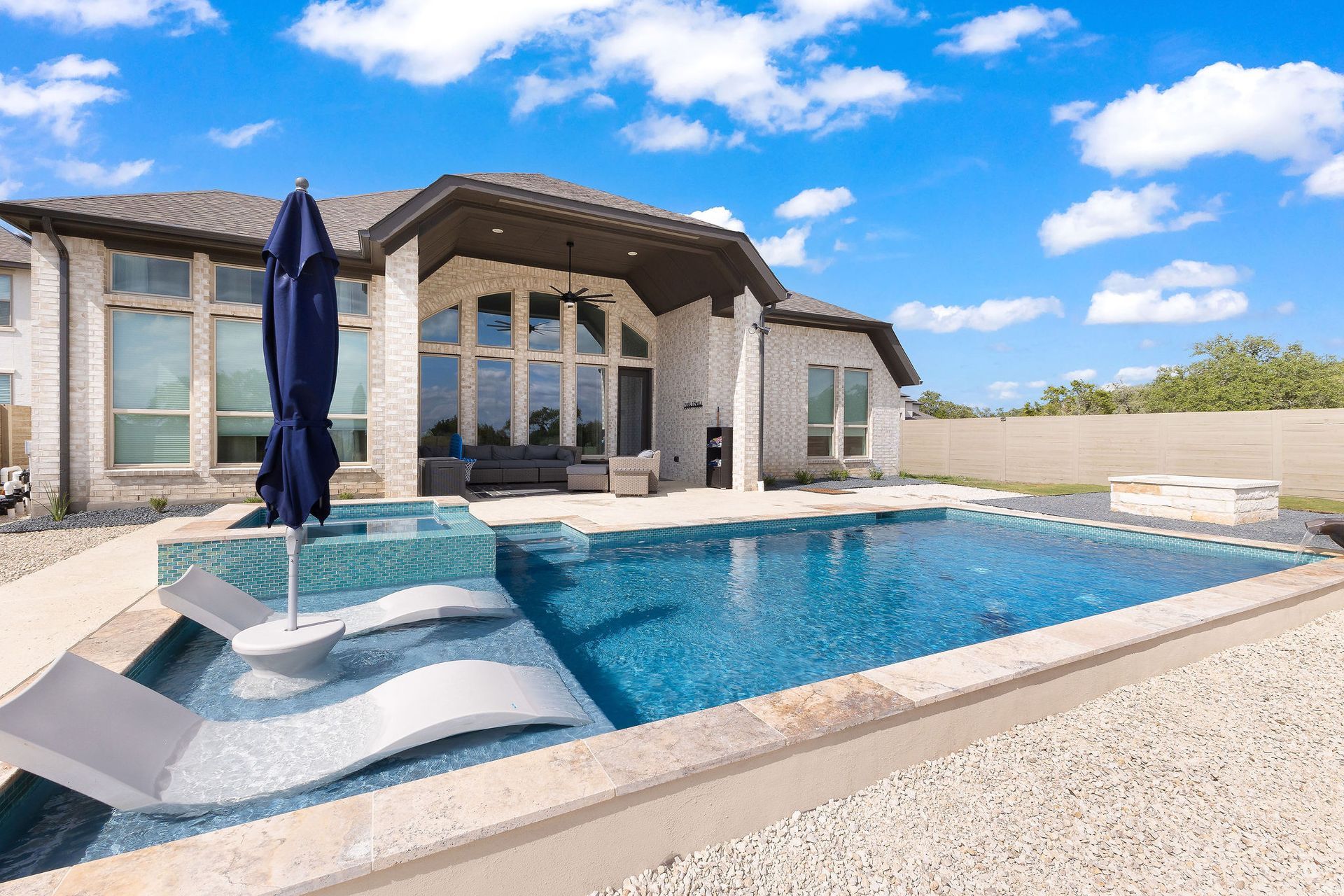 Backyard patio with a rectangular swimming pool