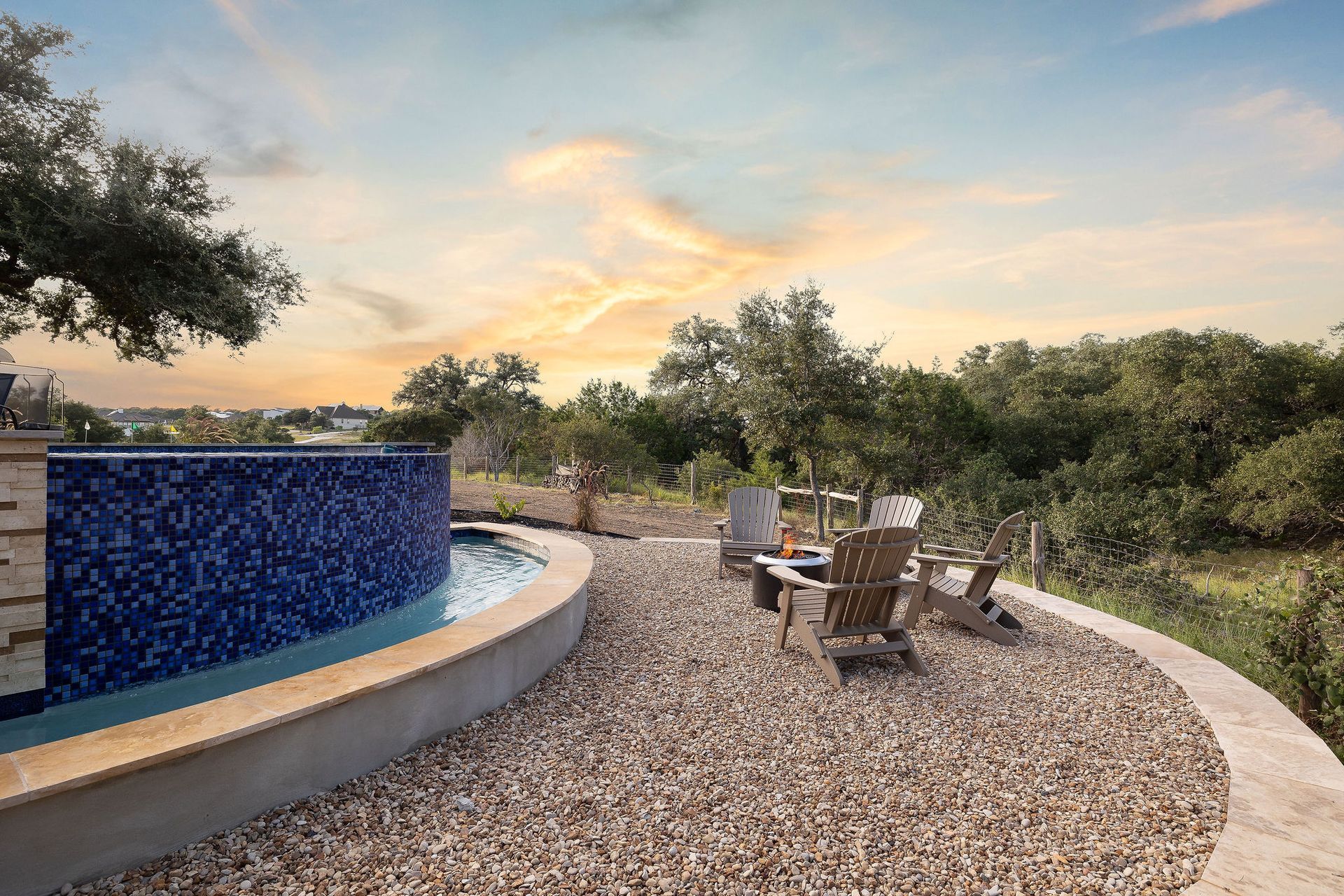 Backyard pool with a raised spa