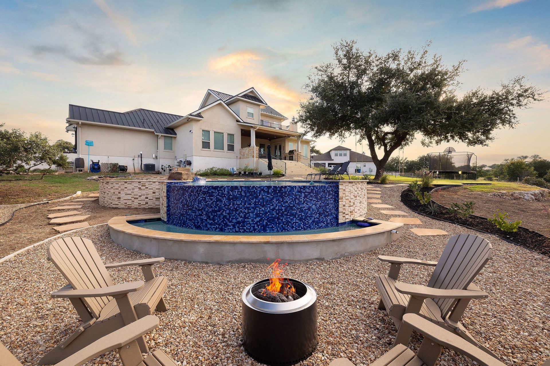Backyard pool with a raised spa